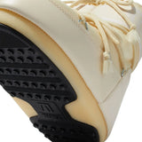 Close up of the brown flats, showing texture of the nylon and rubber fabric
