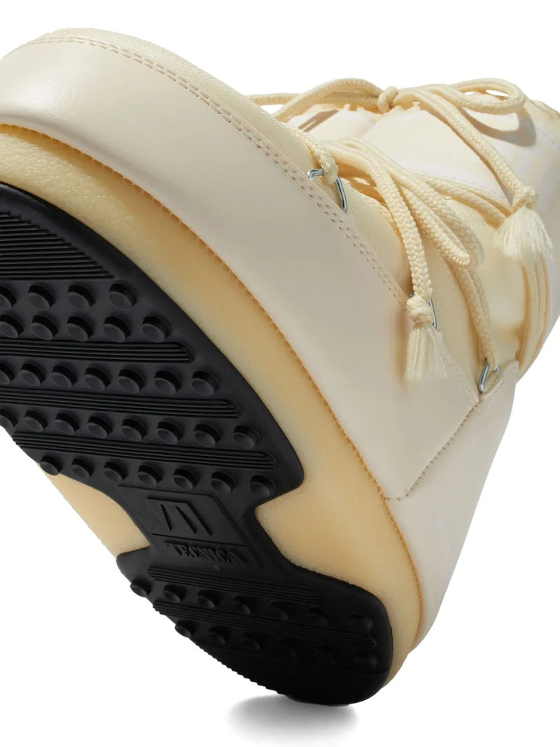 Close up of the brown flats, showing texture of the nylon and rubber fabric
