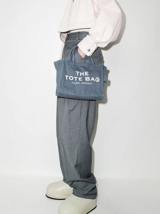 Blue bag, worn by a person, showing the bag's fit