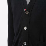 Close up of black knitwear, showing texture of the wool fabric