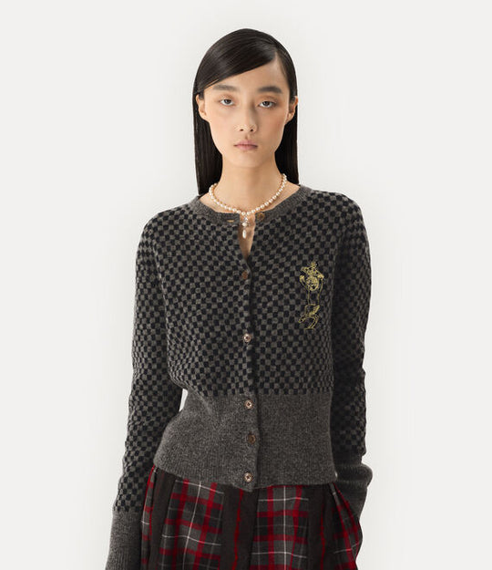 Grey top worn by a person, showing the top fit