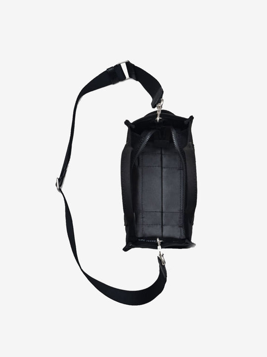 Close up of the black bag, showing texture of the cotton fabric