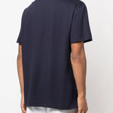 Navy shirt worn by a person, showing the shirt's fit