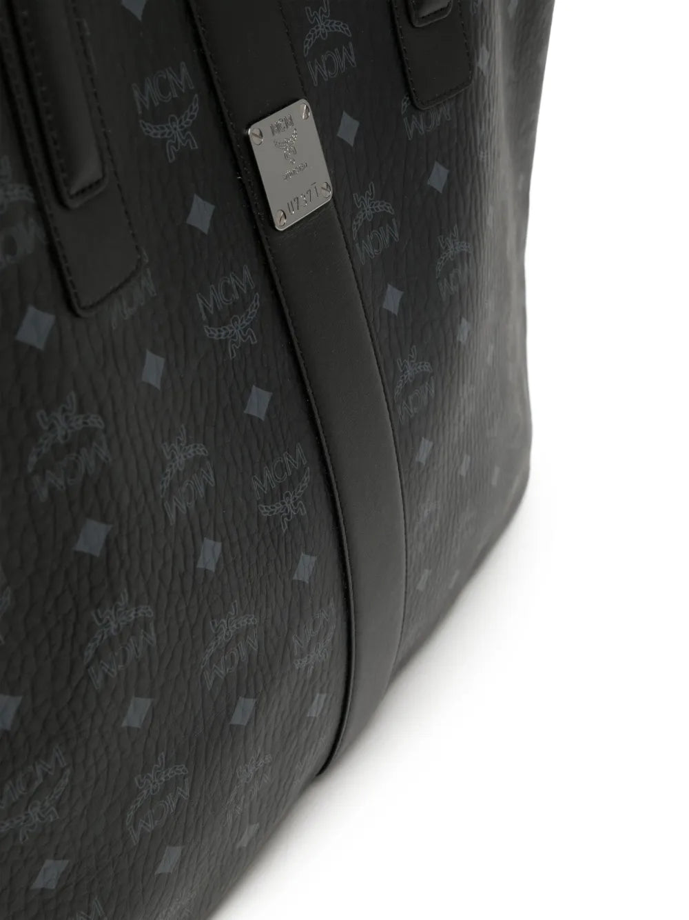 Close up of black bag, showing texture of the leather fabric