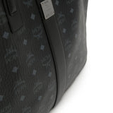 Close up of black bag, showing texture of the leather fabric