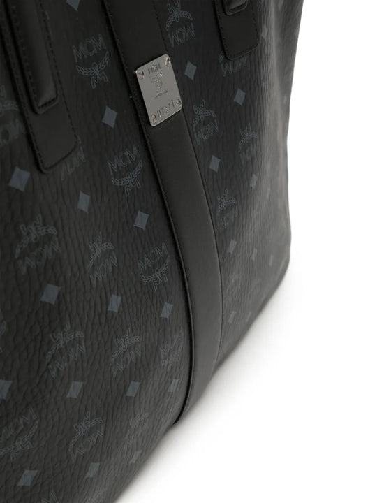 Close up of black bag, showing texture of the leather fabric