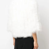 White coat worn by a person, showing the coat fit