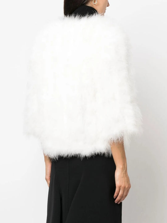 White coat worn by a person, showing the coat fit