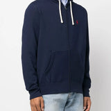 Navy hoodie worn by a person, showing the hoodie's fit