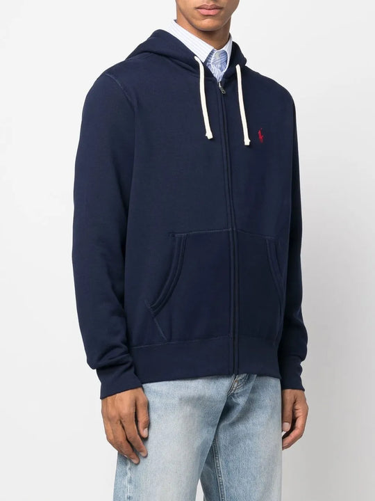 Navy hoodie worn by a person, showing the hoodie's fit
