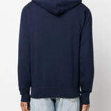 Navy hoodie worn by a person, showing the hoodie's fit