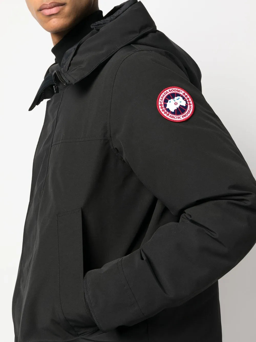 Close up of black jackets, showing texture of the polyester and cotton fabric