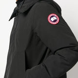 Close up of black jackets, showing texture of the polyester and cotton fabric