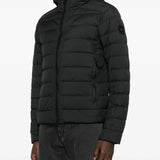 Black jacket worn by a person, showing the jacket fit