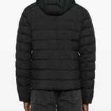 Black jacket worn by a person, showing the jacket fit