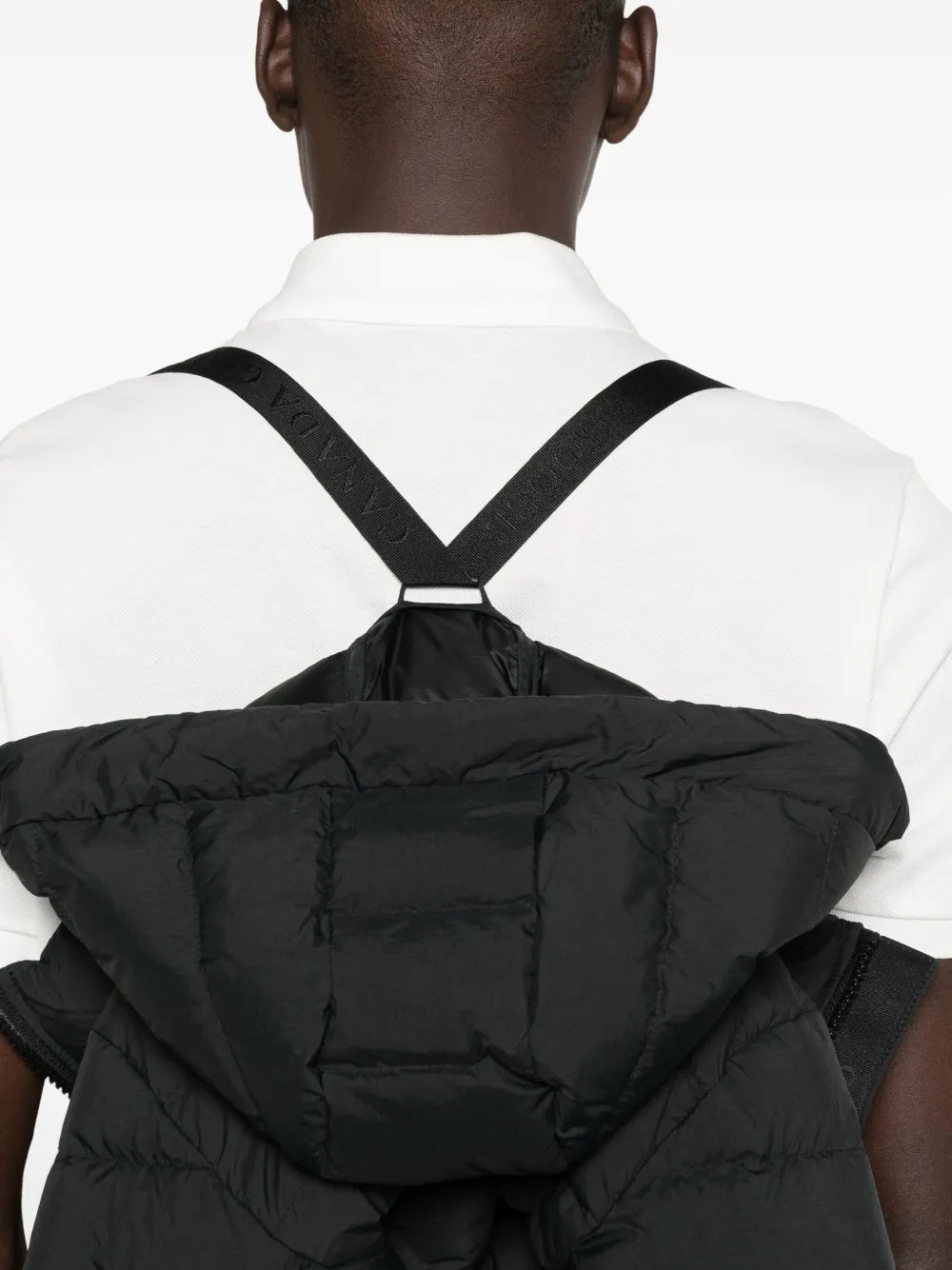 Close up of black jacket,showing texture of the cotton fabric.