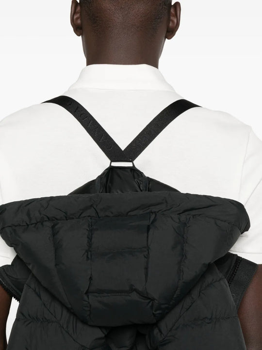 Close up of black jacket,showing texture of the cotton fabric.