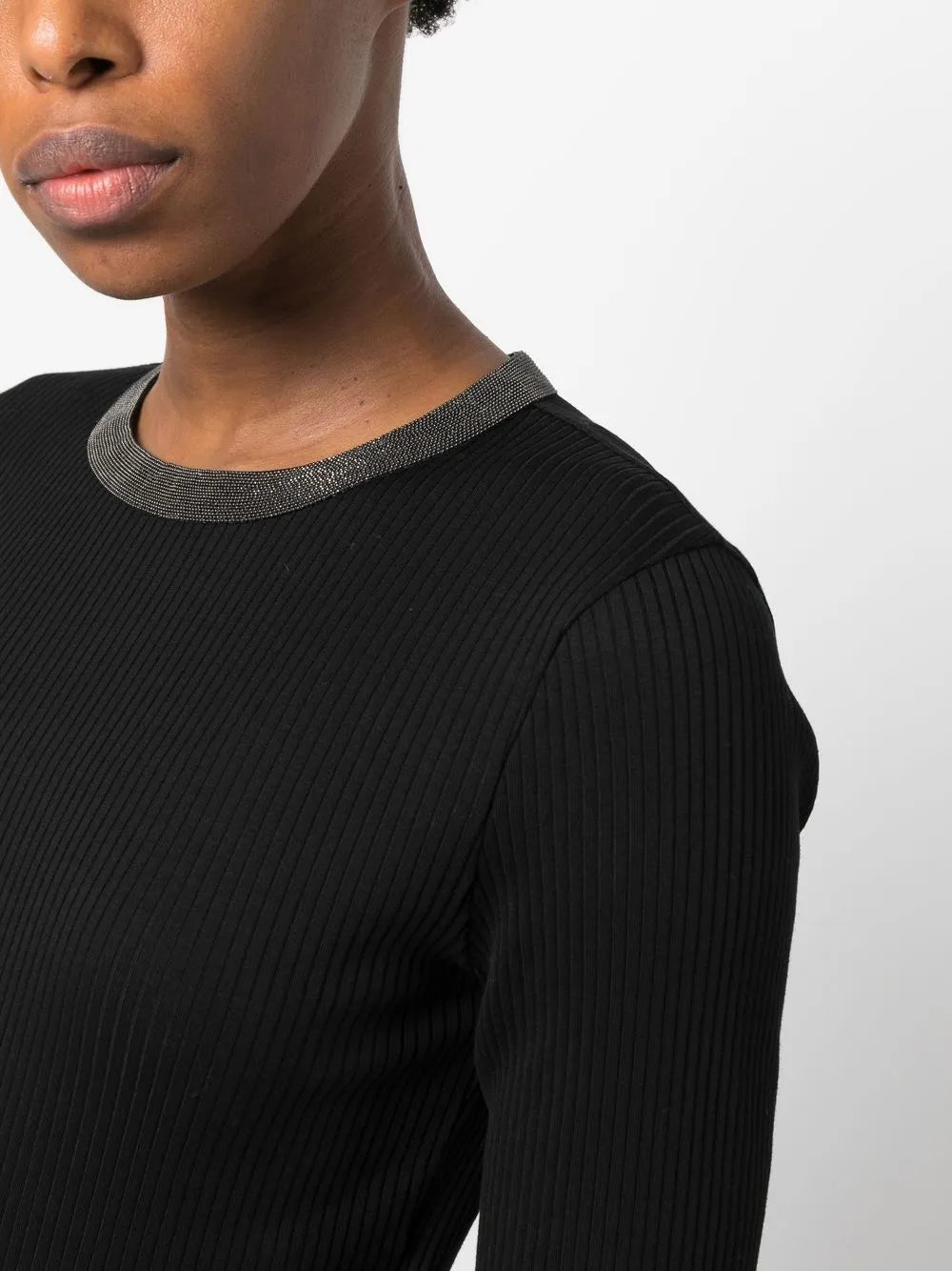 Close up of black tops, showing texture of the cotton and elastane fabric