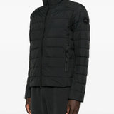 Black jacket worn by a person, showing the jacket fit