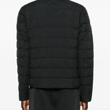 Black jacket worn by a person, showing the jacket fit