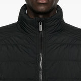 Close up of black jacket,showing texture of the cotton fabric.