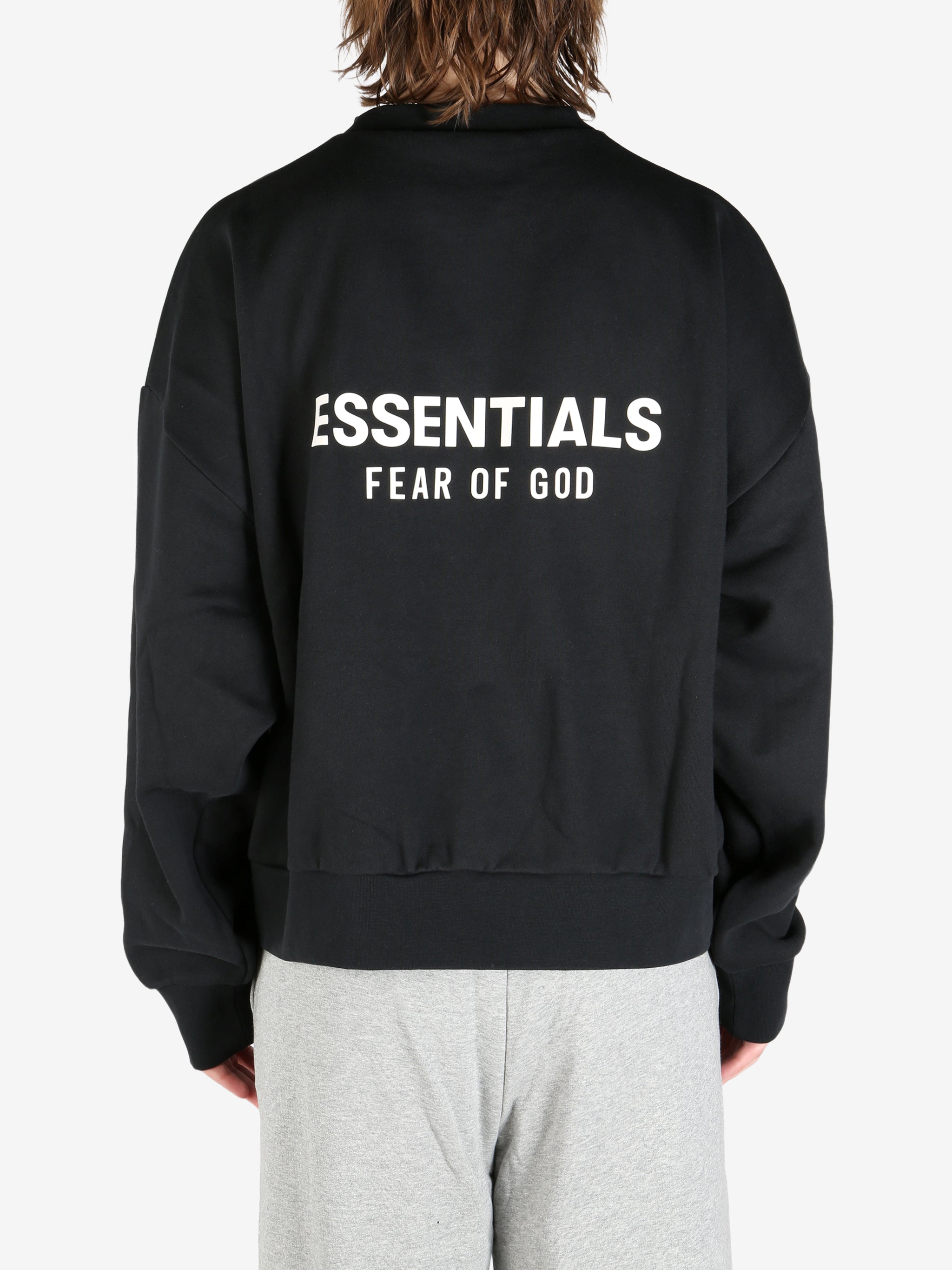 black hoodies worn by a person, showing the hoodies's fit
