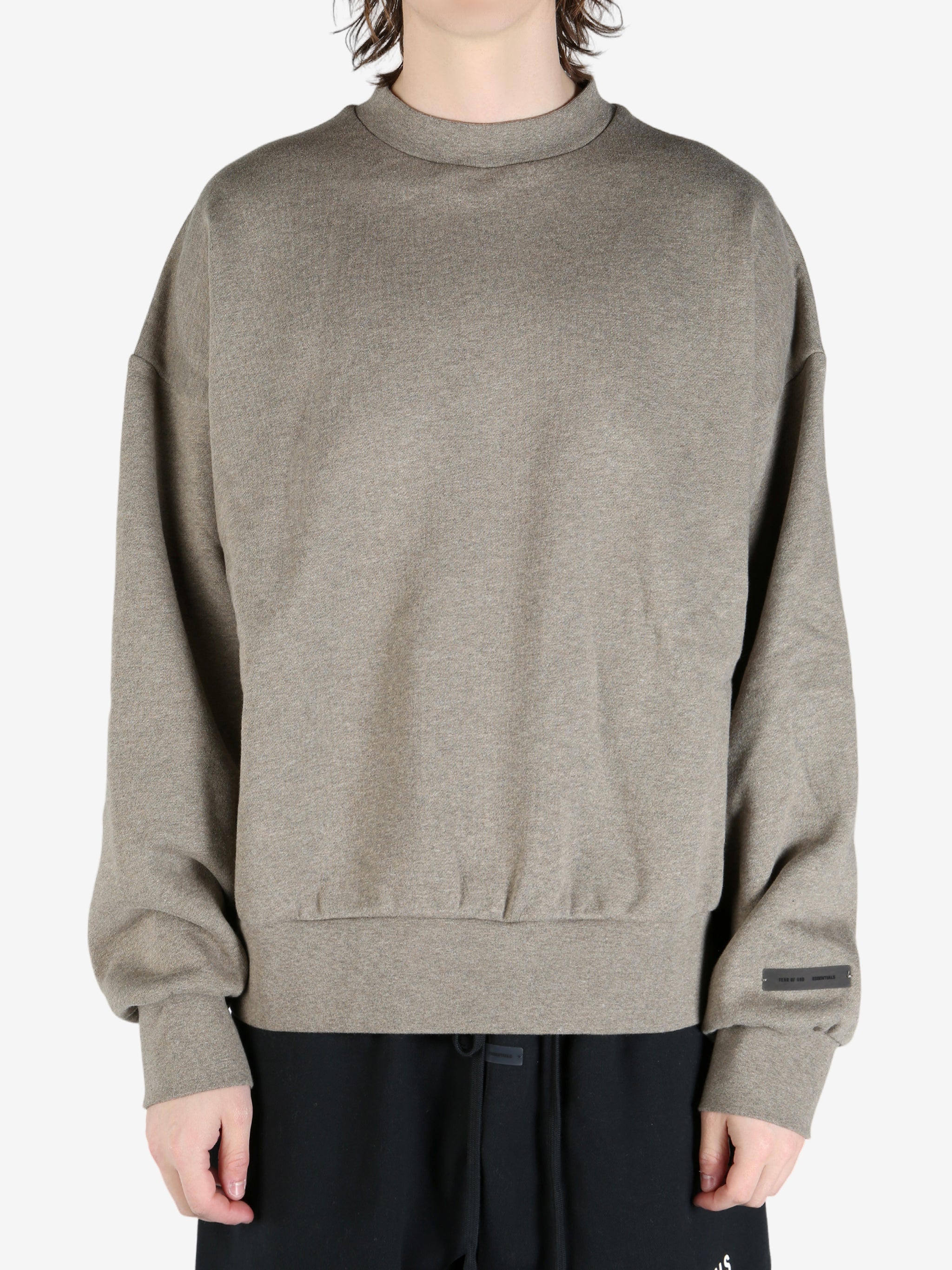 tan hoodies worn by a person, showing the hoodies fit
