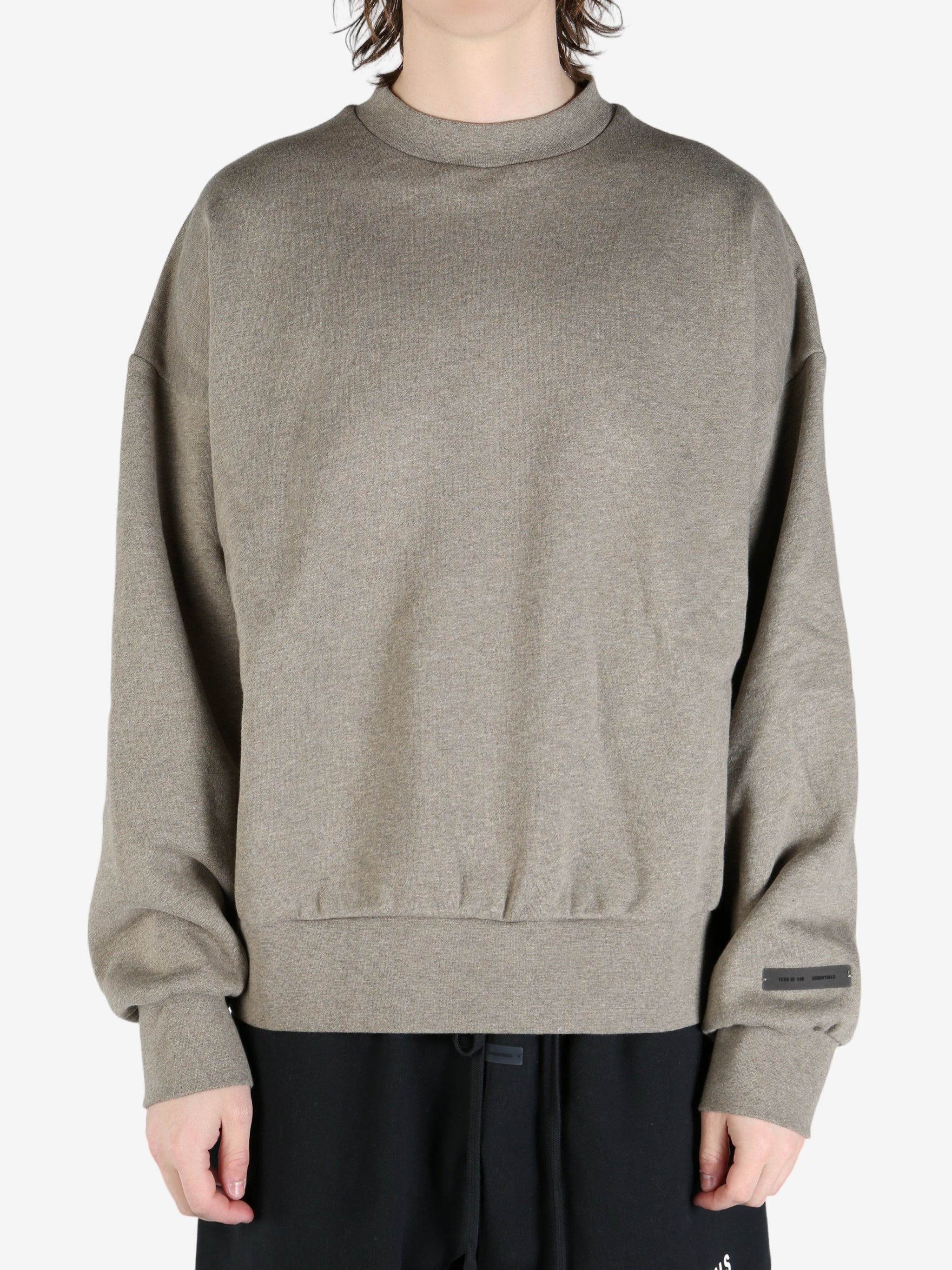 tan hoodies worn by a person, showing the hoodies fit
