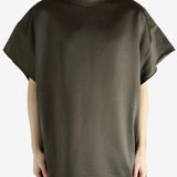 Brown t-shirt worn by a person, showing the shirt's fit