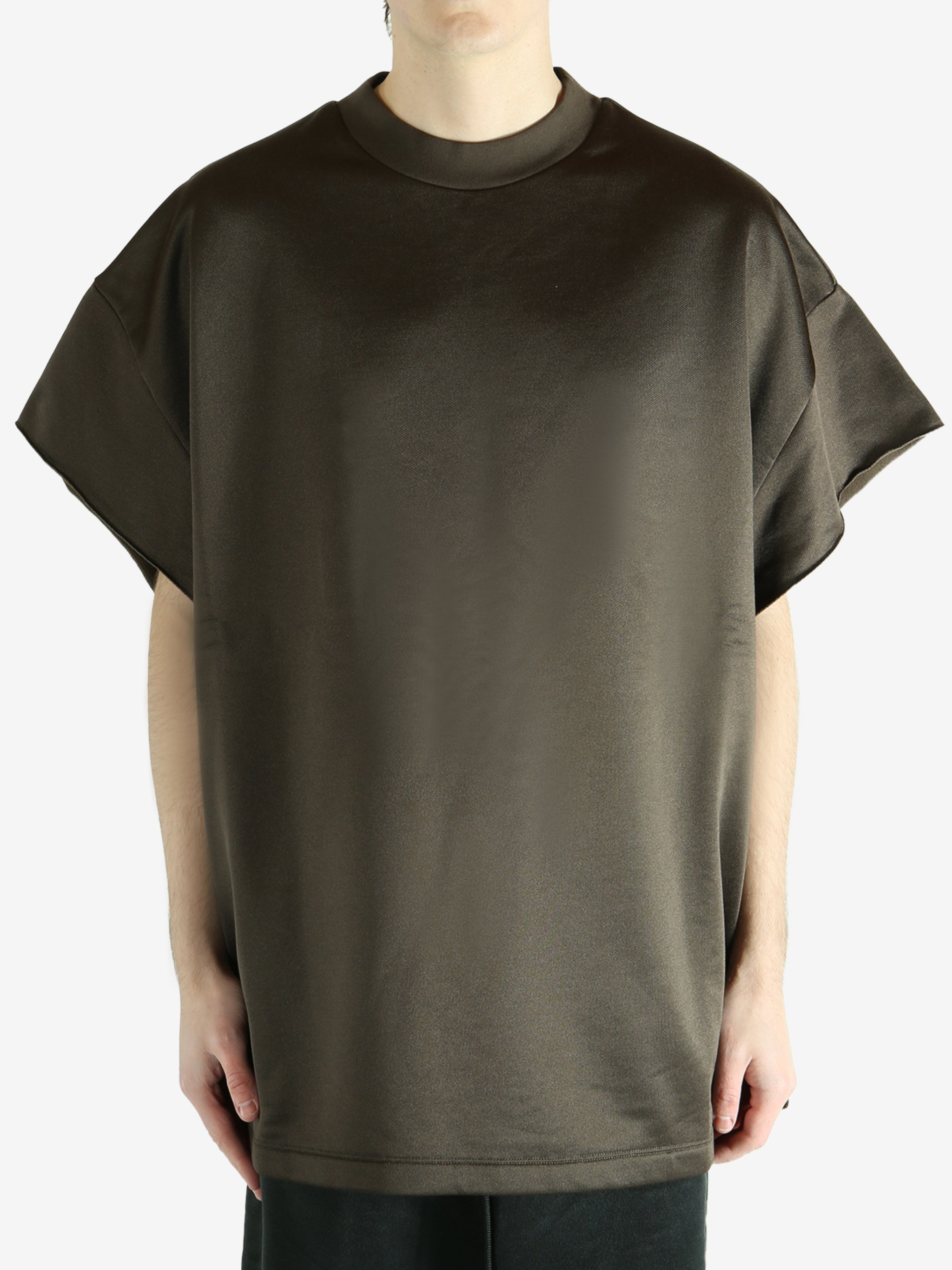 Brown t-shirt worn by a person, showing the shirt's fit