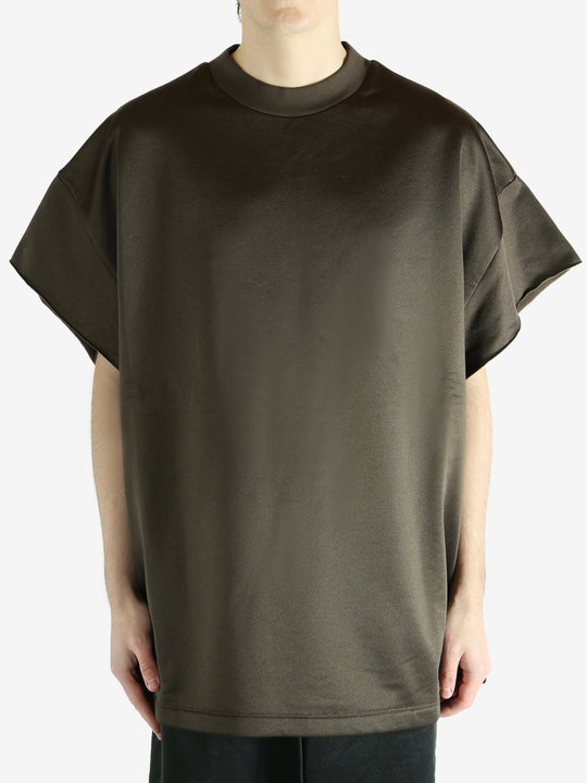 Brown t-shirt worn by a person, showing the shirt's fit