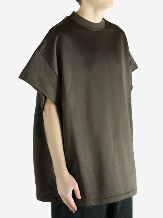 Brown t-shirt worn by a person, showing the shirt's fit