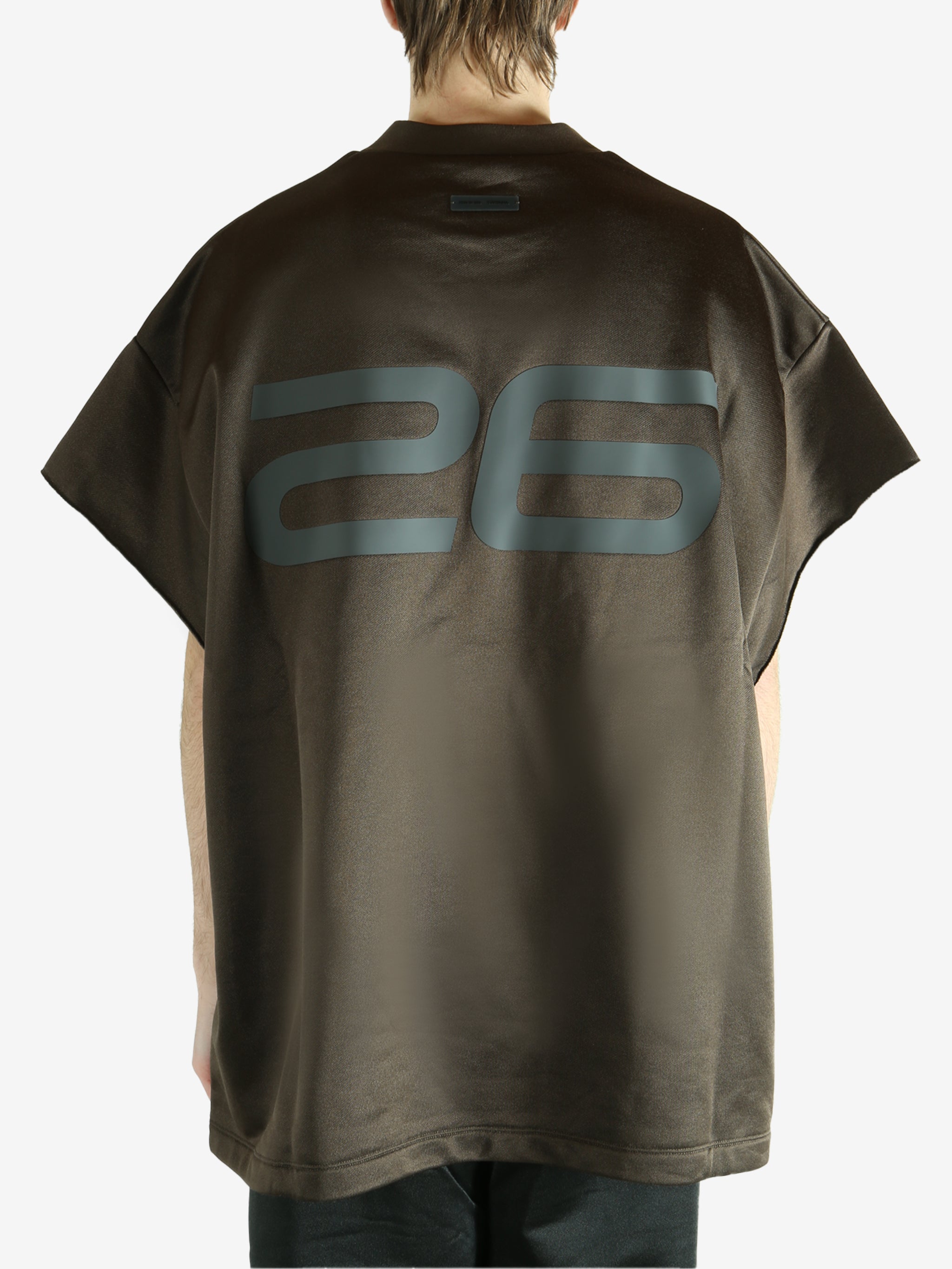 Brown t-shirt worn by a person, showing the shirt's fit
