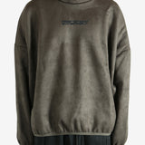 Green hoodie worn by a person, showing the hoodie fit