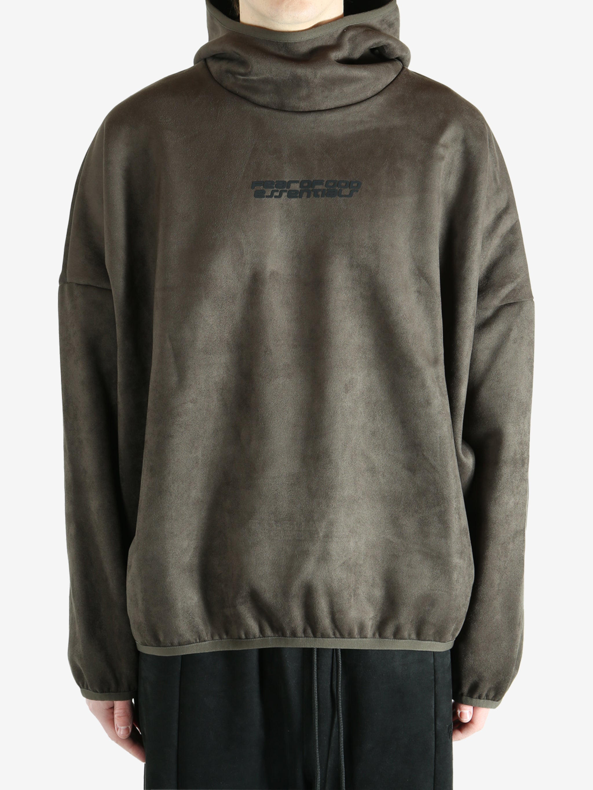 Green hoodie worn by a person, showing the hoodie fit