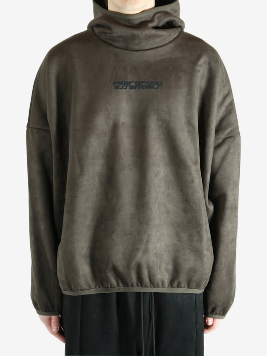 Green hoodie worn by a person, showing the hoodie fit