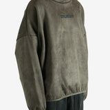 Green hoodie worn by a person, showing the hoodie fit