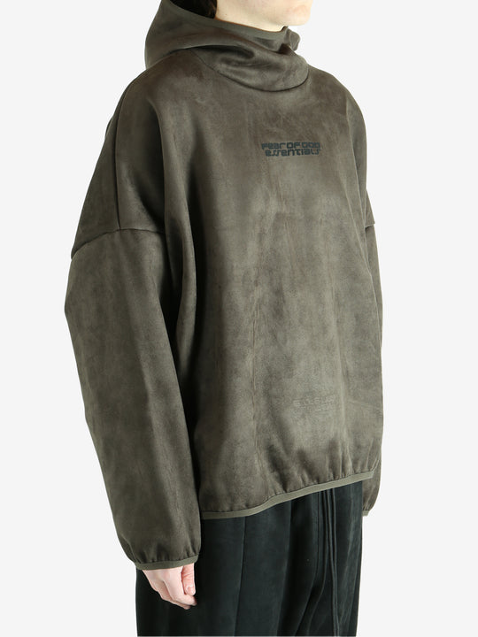 Green hoodie worn by a person, showing the hoodie fit