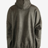 Green hoodie worn by a person, showing the hoodie fit