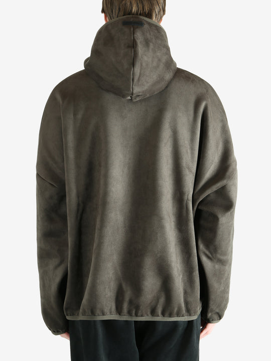 Green hoodie worn by a person, showing the hoodie fit