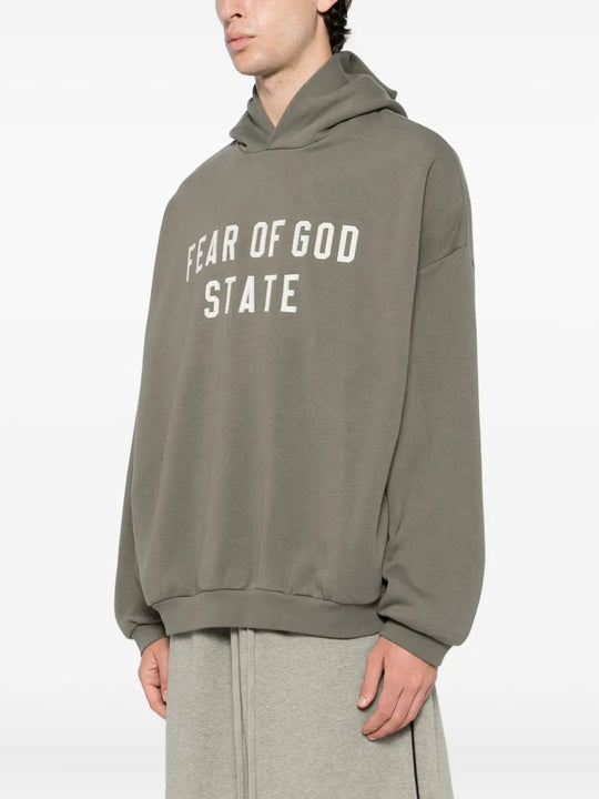 Grey hoodie worn by a person, showing the hoodie fit