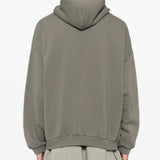 Grey hoodie worn by a person, showing the hoodie fit