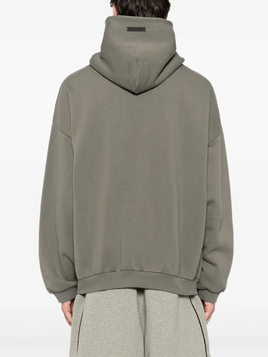 Grey hoodie worn by a person, showing the hoodie fit