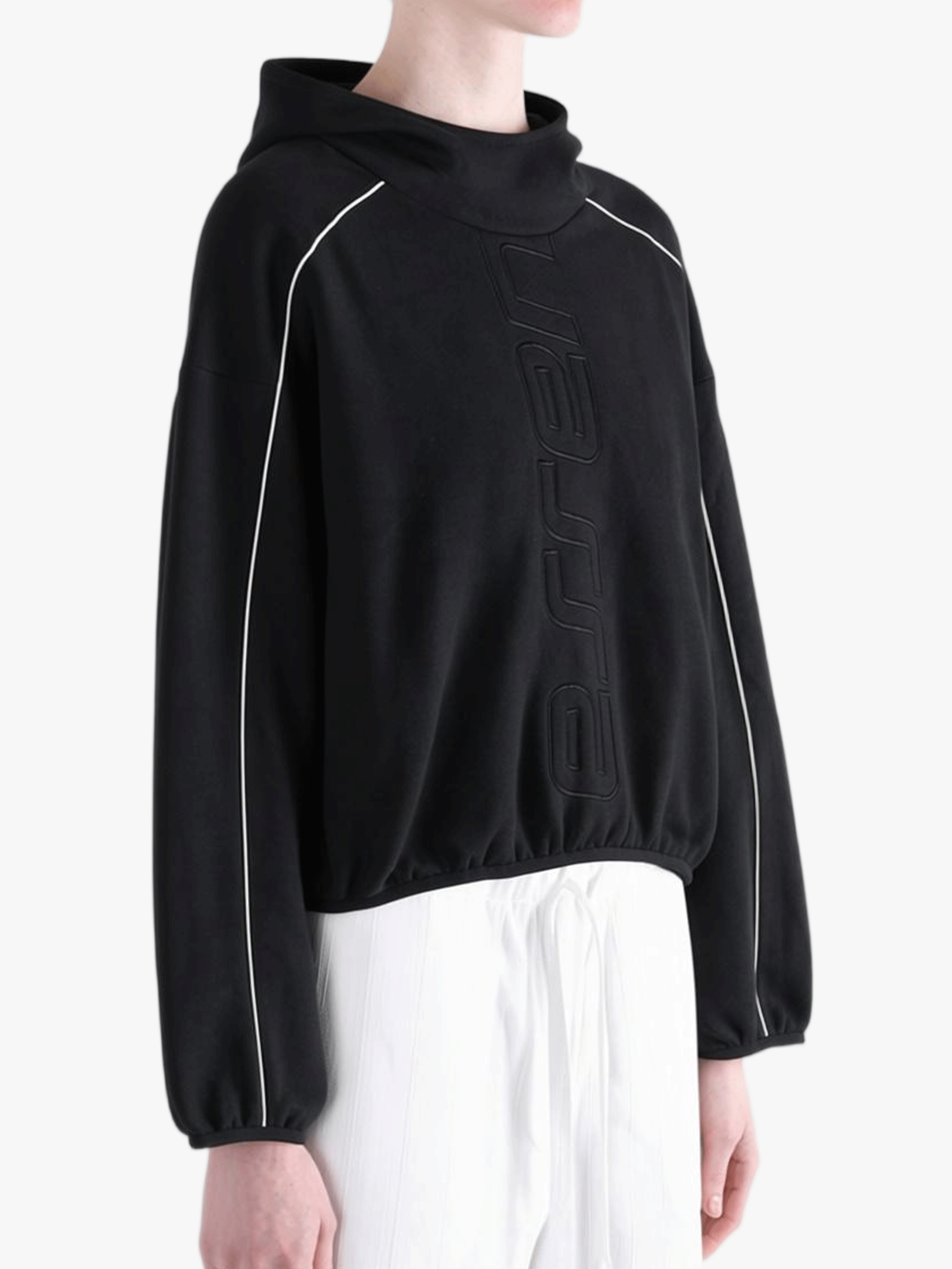 Black hoodie worn by a person, showing the hoodie's fit