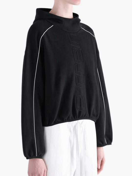 Black hoodie worn by a person, showing the hoodie's fit