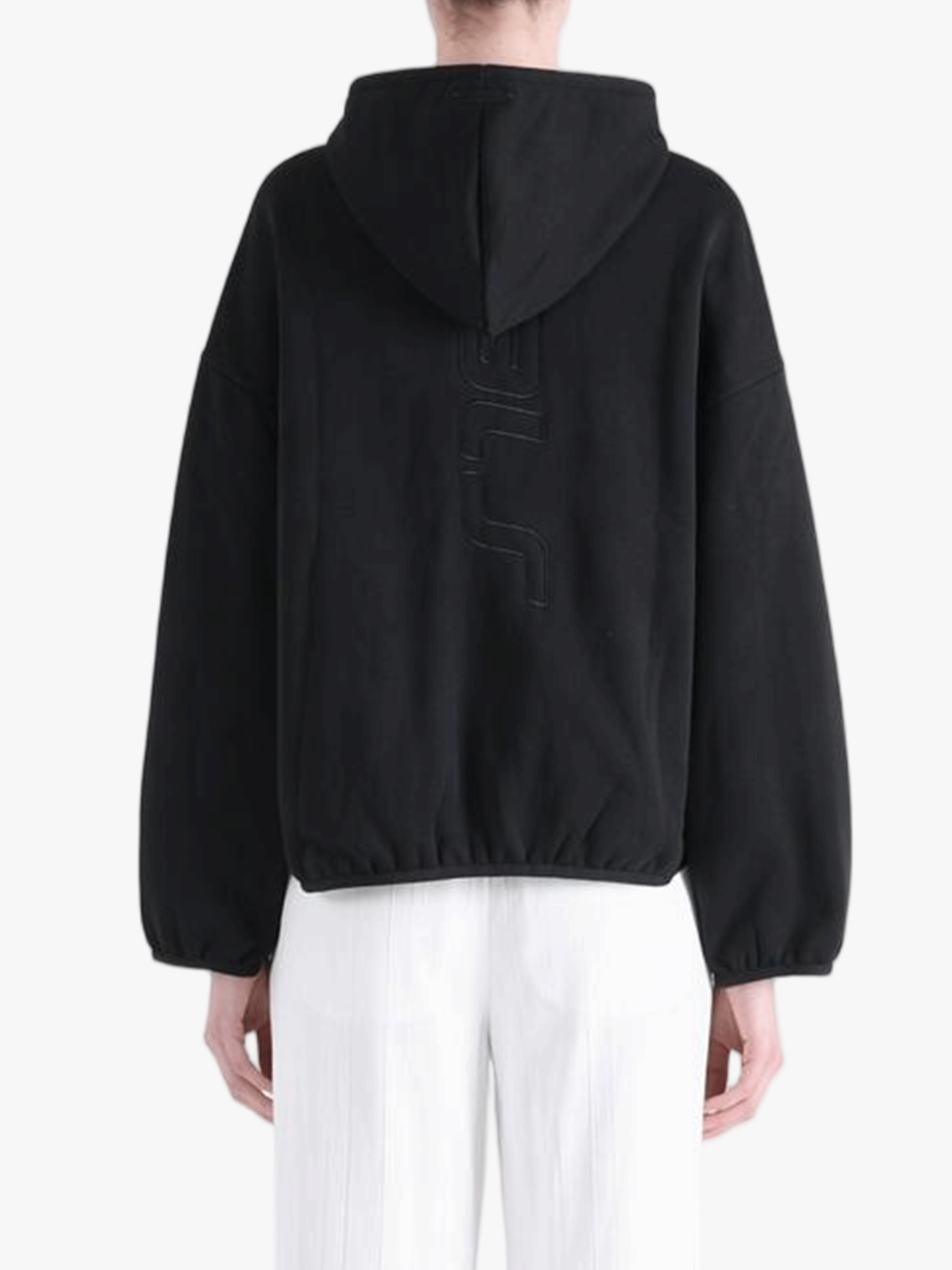 Black hoodie worn by a person, showing the hoodie's fit