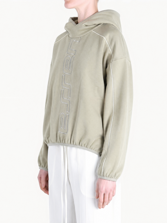 Tan hoodie worn by a person, showing the hoodie fit