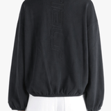 Black shirts worn by a person, showing the shirts fit