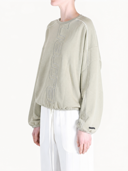Tan hoodie worn by a person, showing the hoodie fit