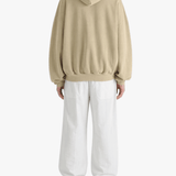 Tan hoodies worn by a person, showing the hoodies fit